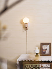 Dione - Travertine and Opal Globe Sconce