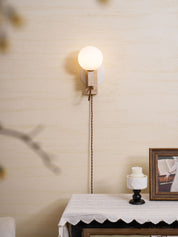 Dione - Travertine and Opal Globe Sconce