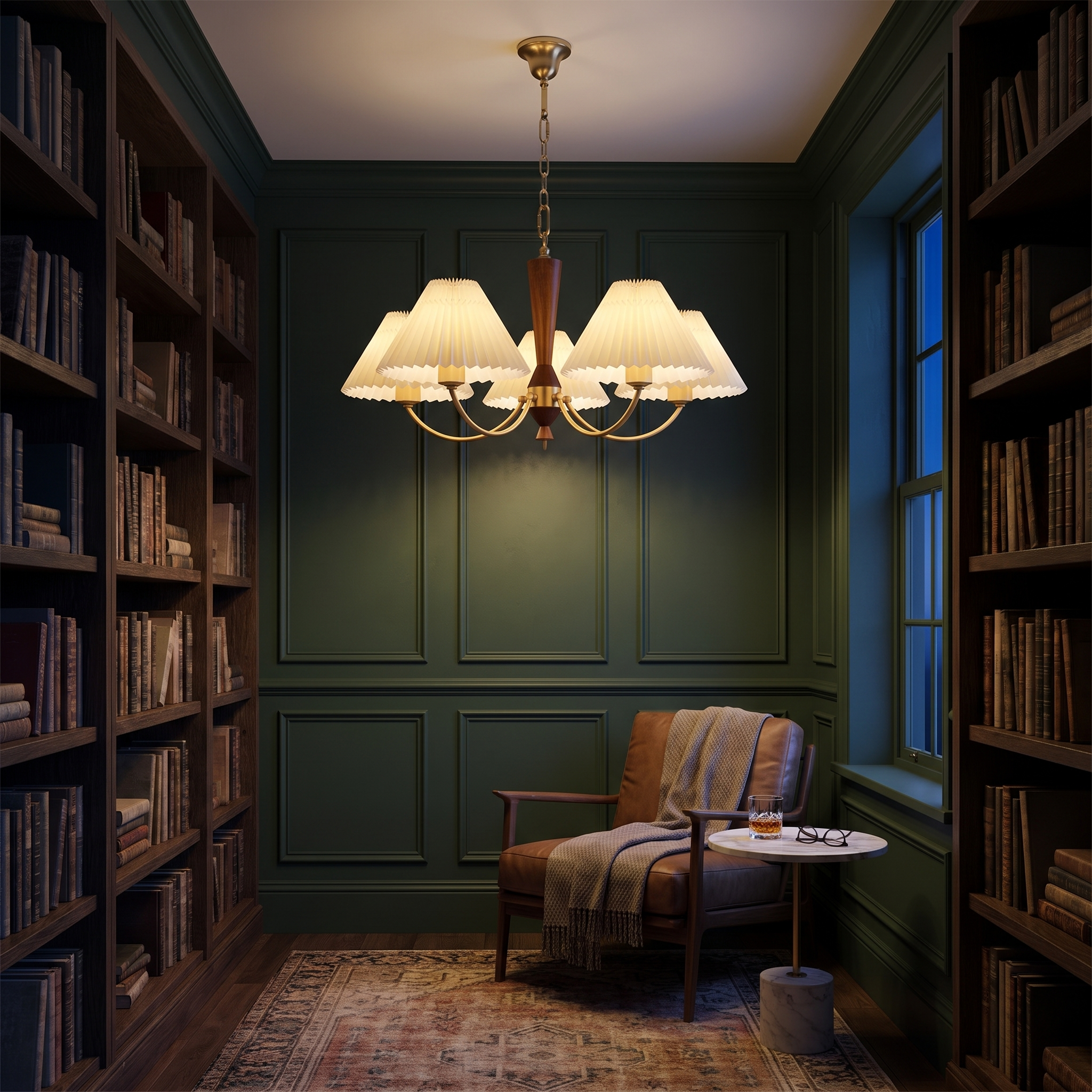 Baukis pleated shade copper and walnut chandelier lit in a dark forest green panelled reading room with bookshelves