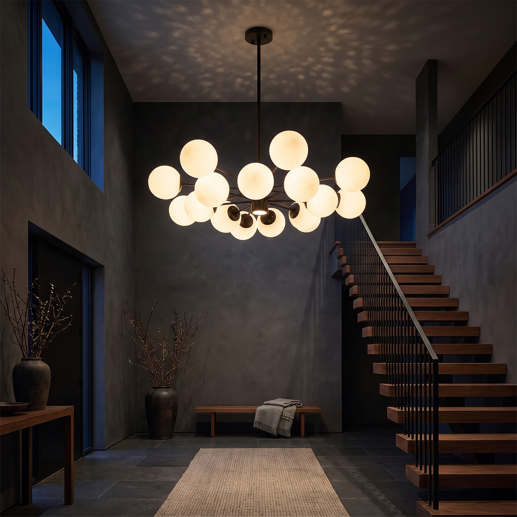 Chairephon Glass Globe Cluster Sputnik Chandelier in a dark double-height entrance hall with walnut staircase