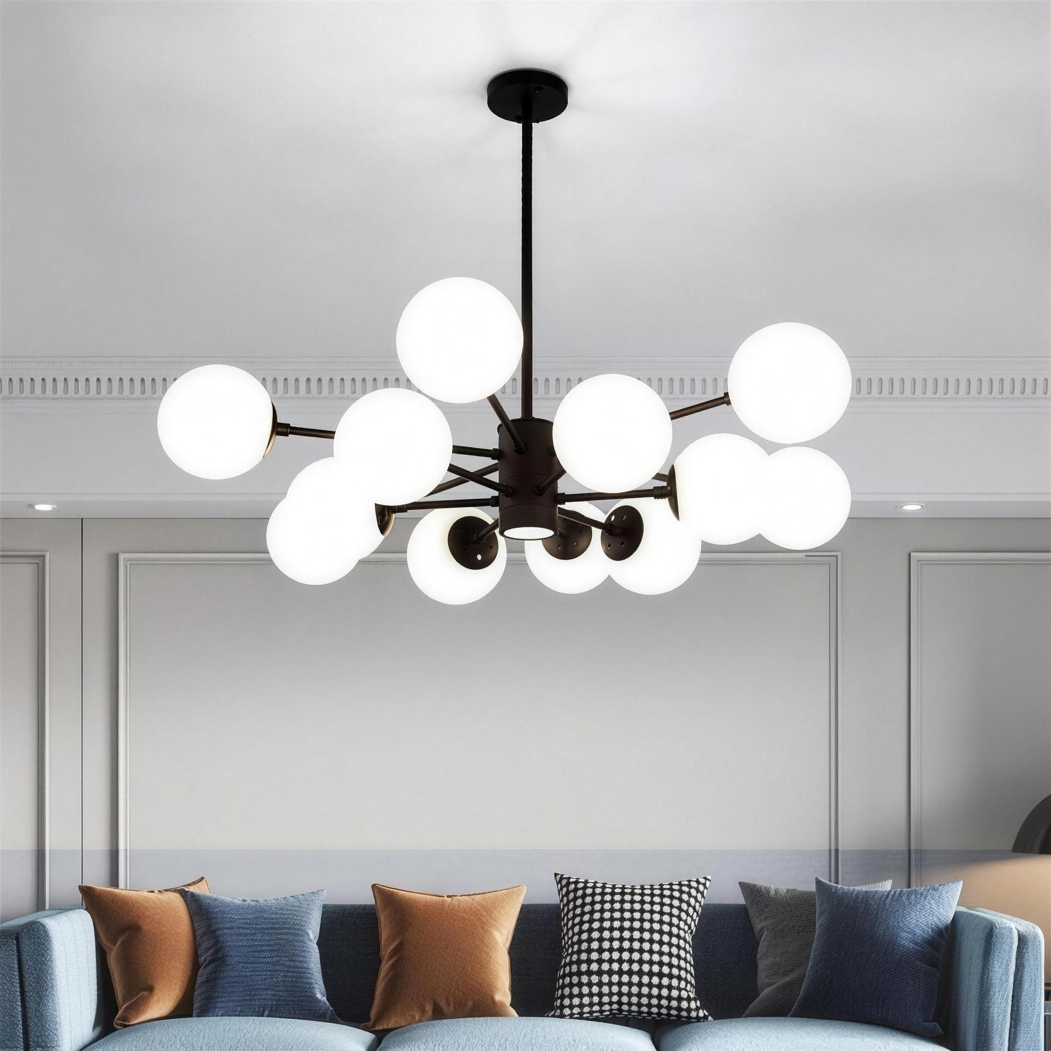 Nordic glass globe cluster chandelier suspended in an entryway, clear spheres catching the light