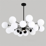 Side profile of the Chairephon chandelier showing the staggered heights of its glass spheres