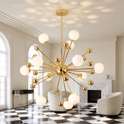Aiolos gold glass globe sputnik chandelier lit in a bright Art Deco drawing room with a checkerboard marble floor