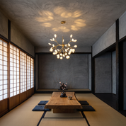 Chryseis 36-light gold sputnik chandelier lit above a low elm table in a Japanese tatami and shoji room