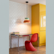 Amaryllis two-tone pendant light over a desk in a graphic yellow home study