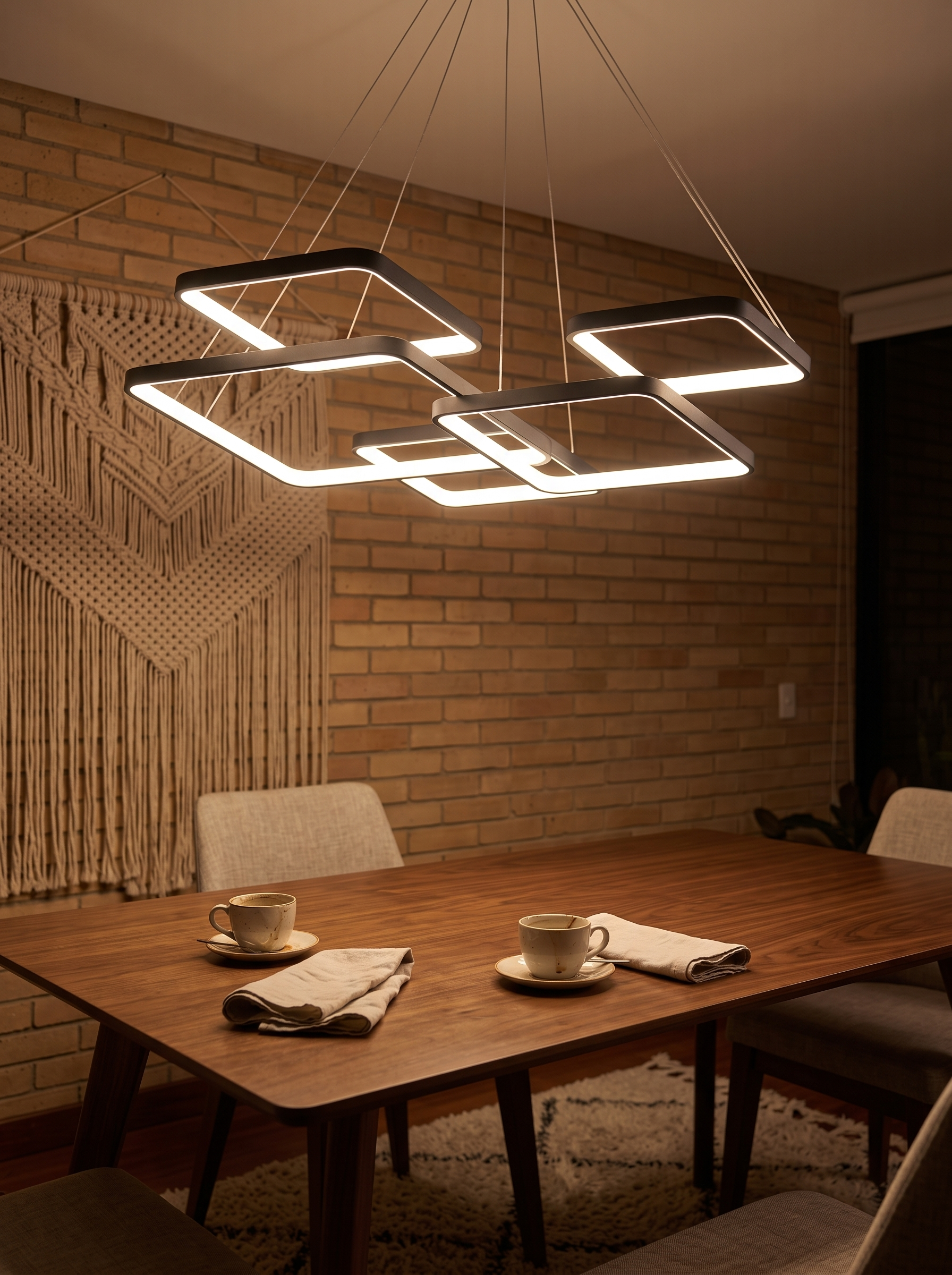 Hermokrates LED Square Chandelier lighting a dining room at night