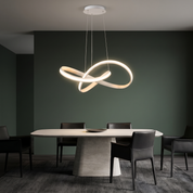Hagnon Mobius ring LED pendant in white in a Scandi-noir dining space