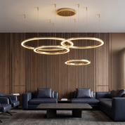 Glykera layered ring LED ceiling light four rings in gold in an executive lounge