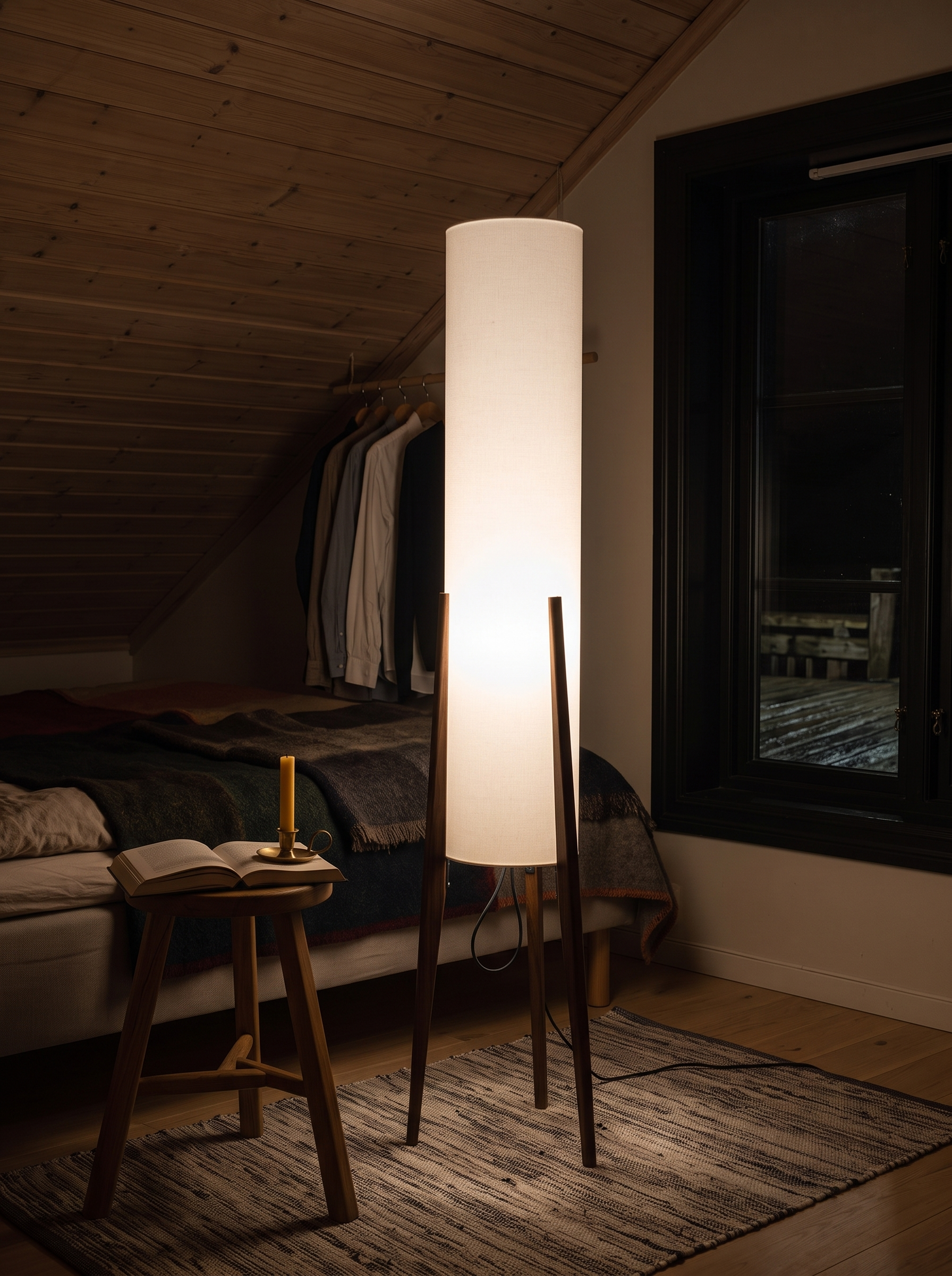 Astyoche walnut and fabric floor lamp lighting a bedroom at night