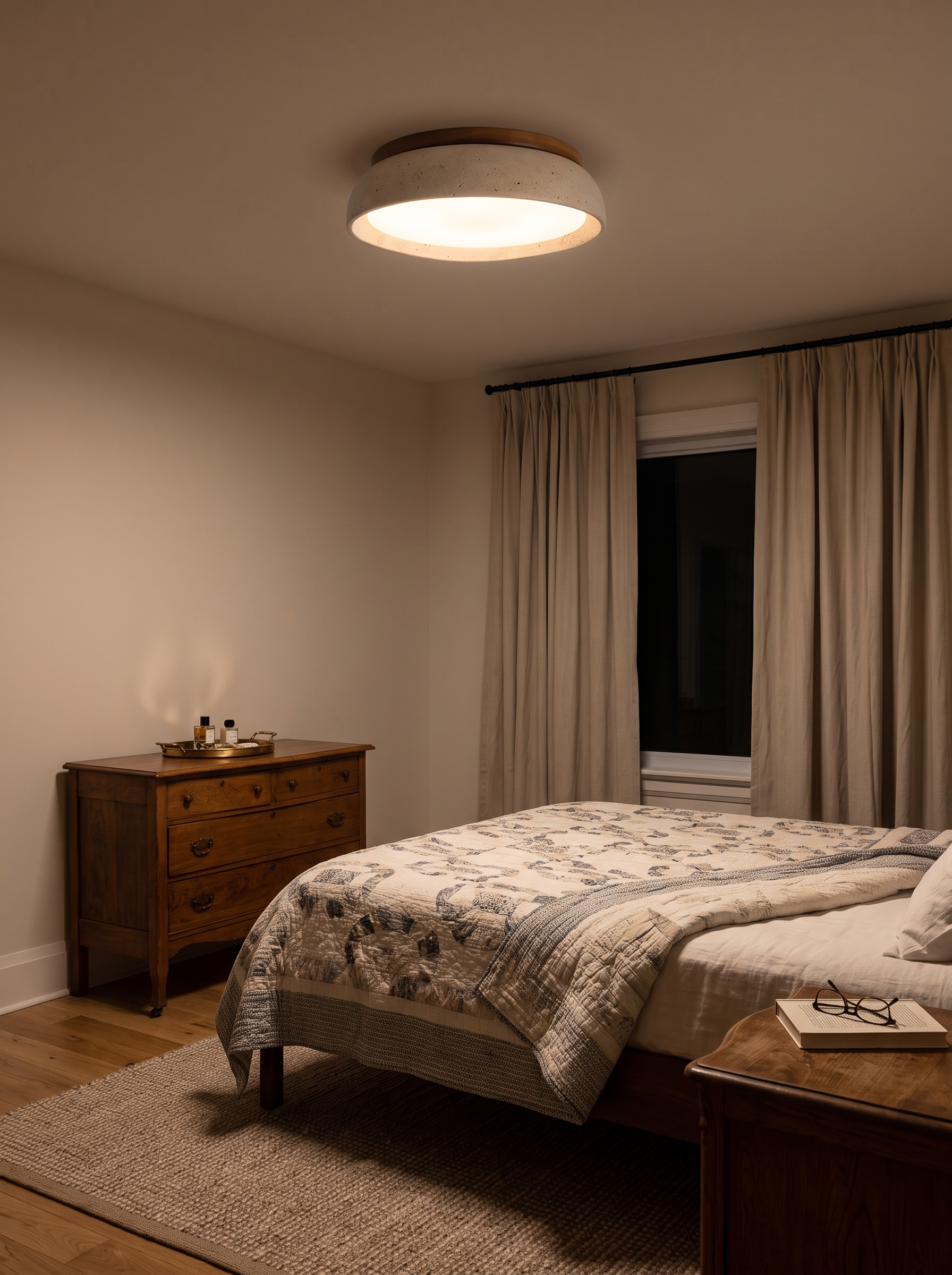 Kalypso travertine flush mount ceiling light lighting a bedroom at night