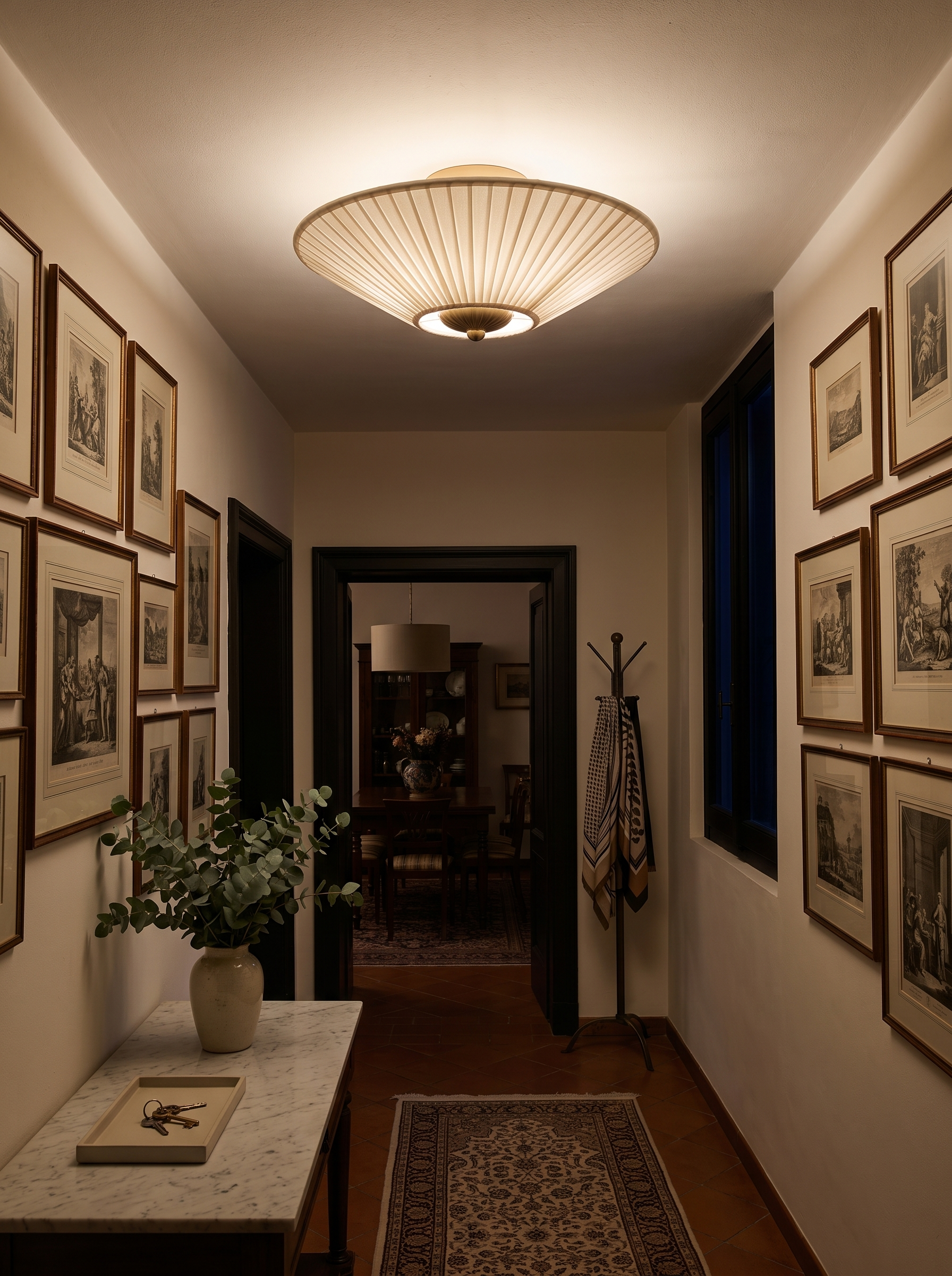 Stephane pleated fabric ceiling lamp lighting an entrance hall at night