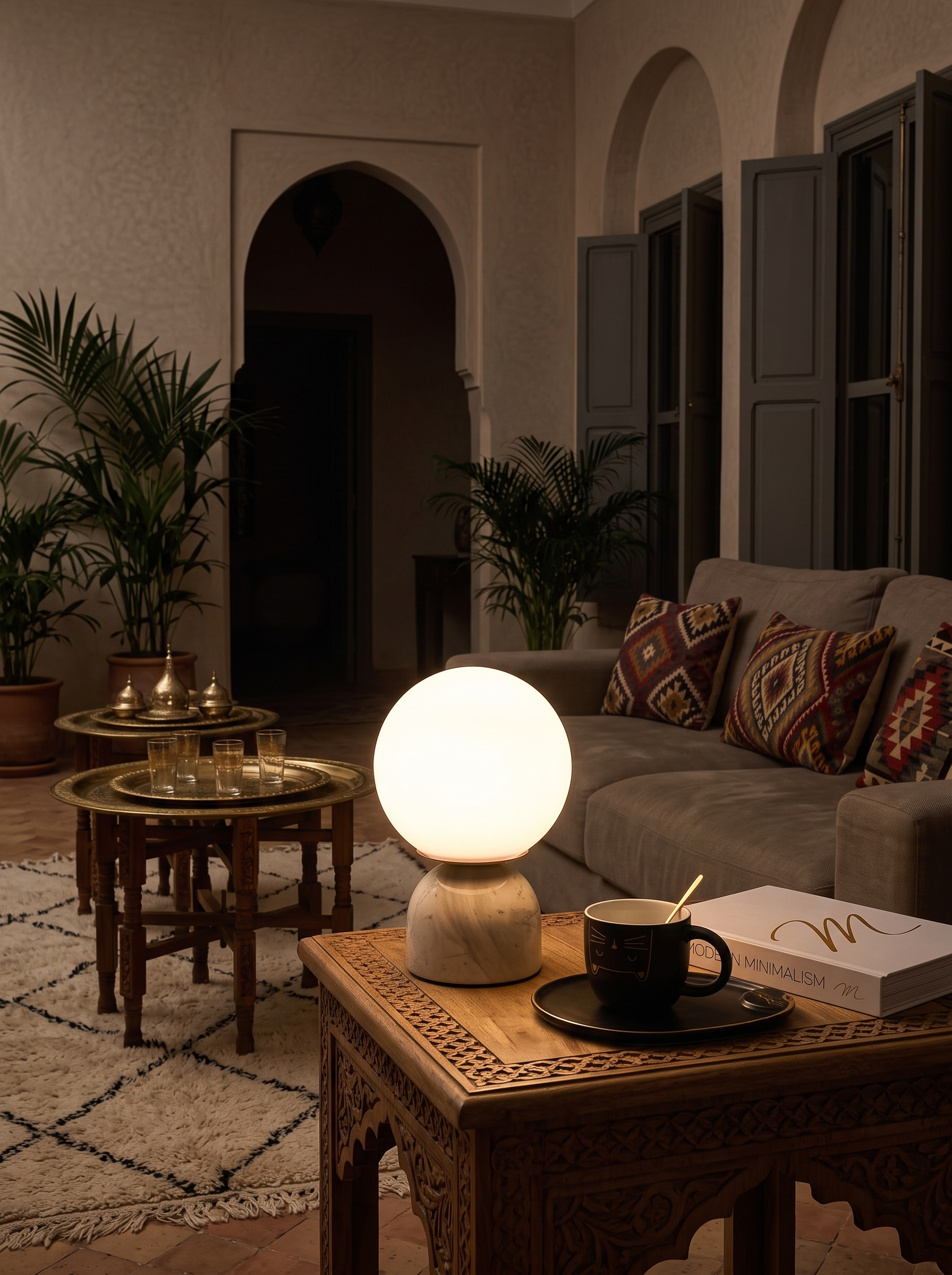 Semele marble and glass globe table lamp as the only light in a room at night