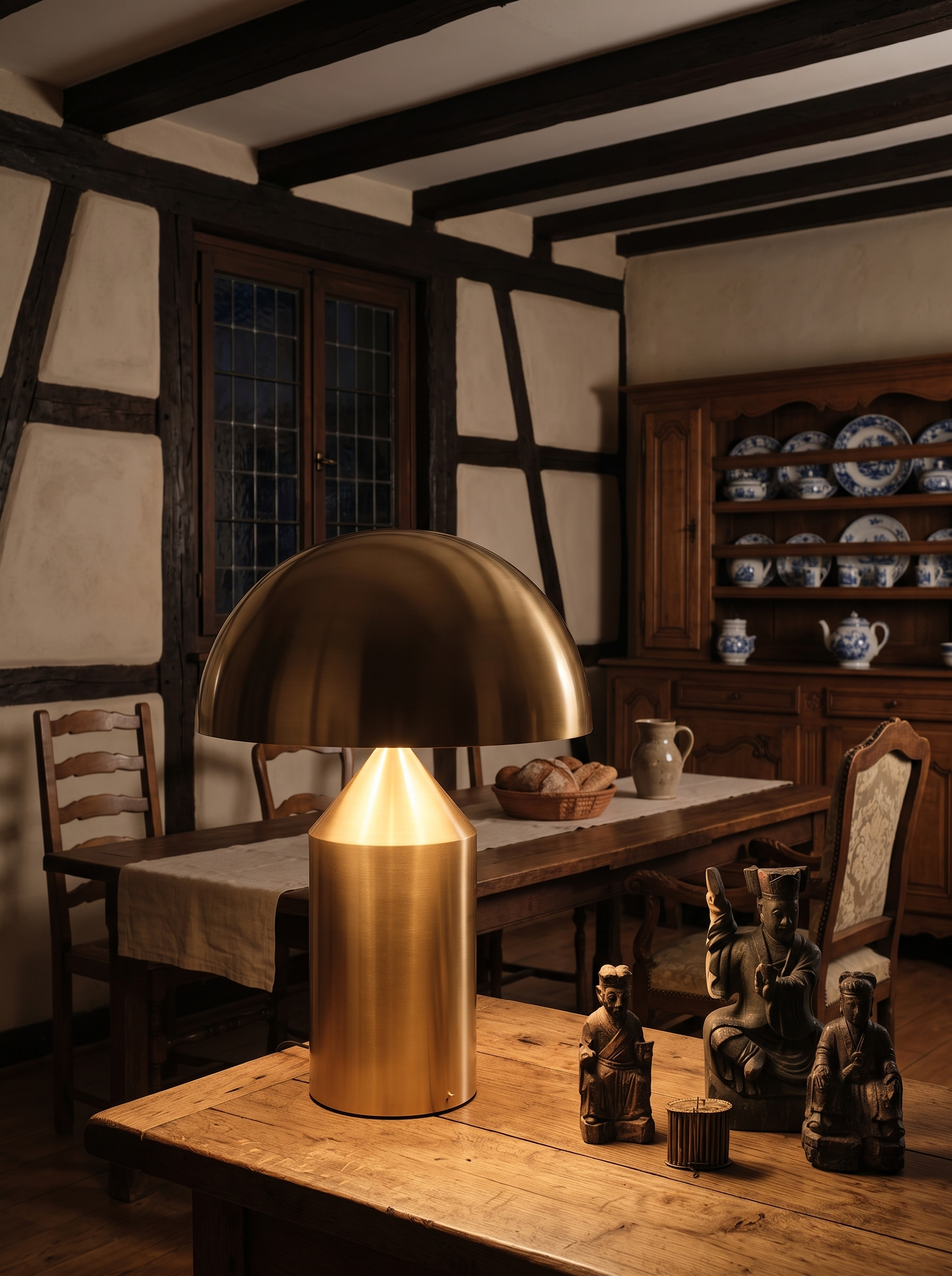 Metis geometric metal table lamp as the only light in a dining room at night
