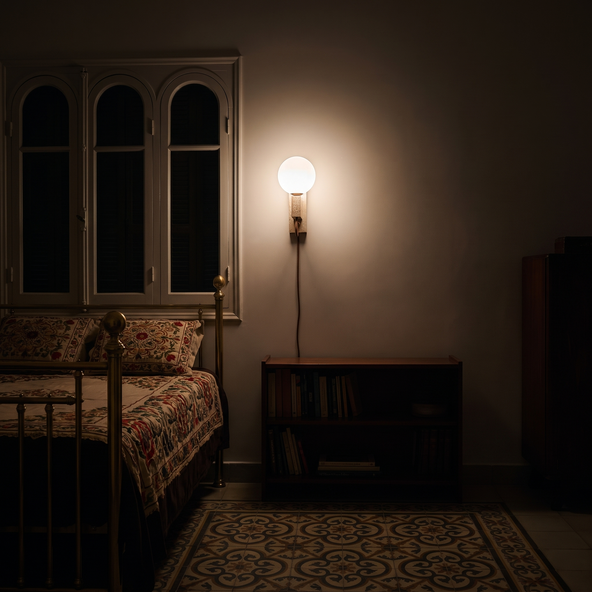 Dione Travertine and Opal Globe Sconce lit at night in a Beirut 1930s apartment bedroom