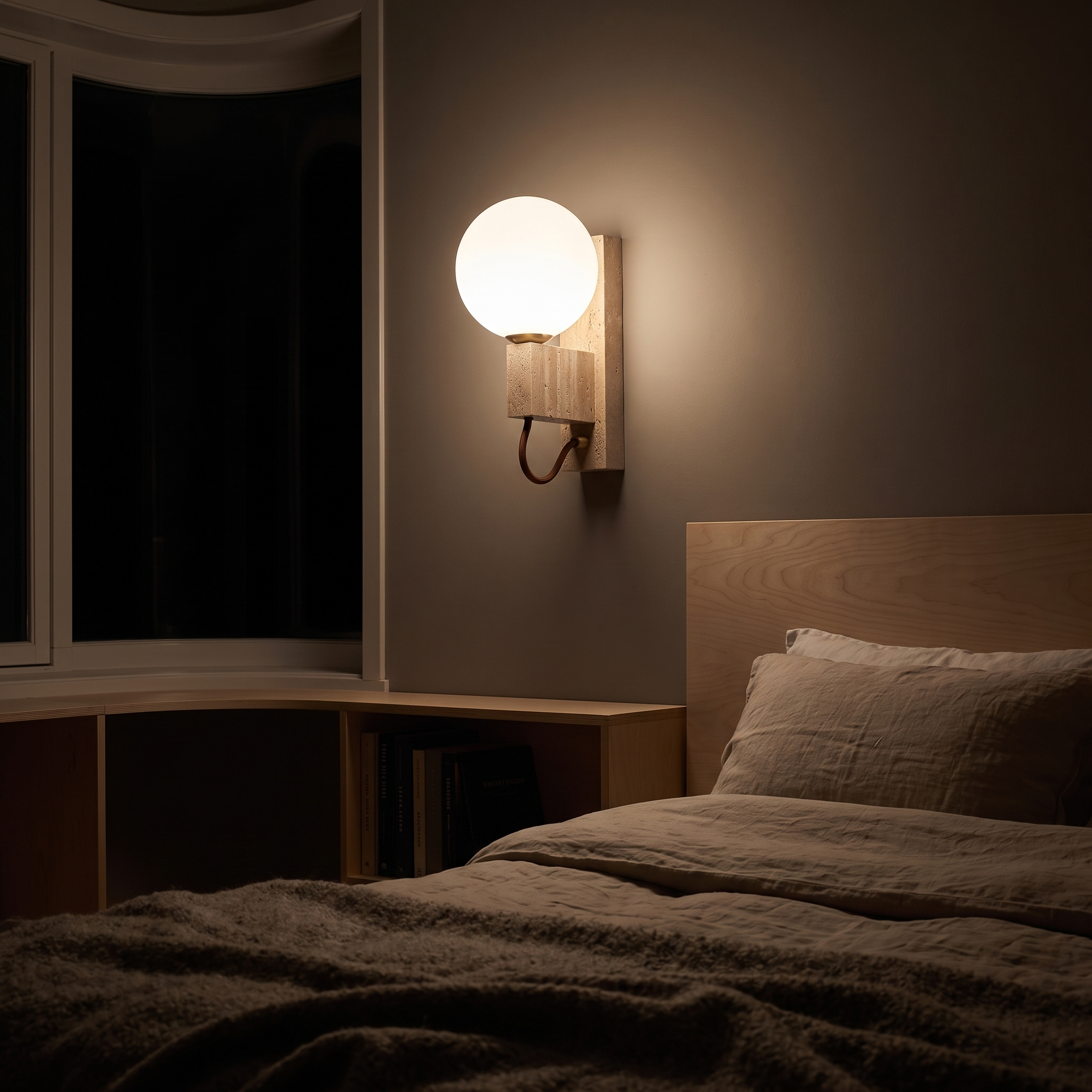 Halie Travertine and Opal Sphere Sconce lit at night in an Oslo functionalist apartment bedroom