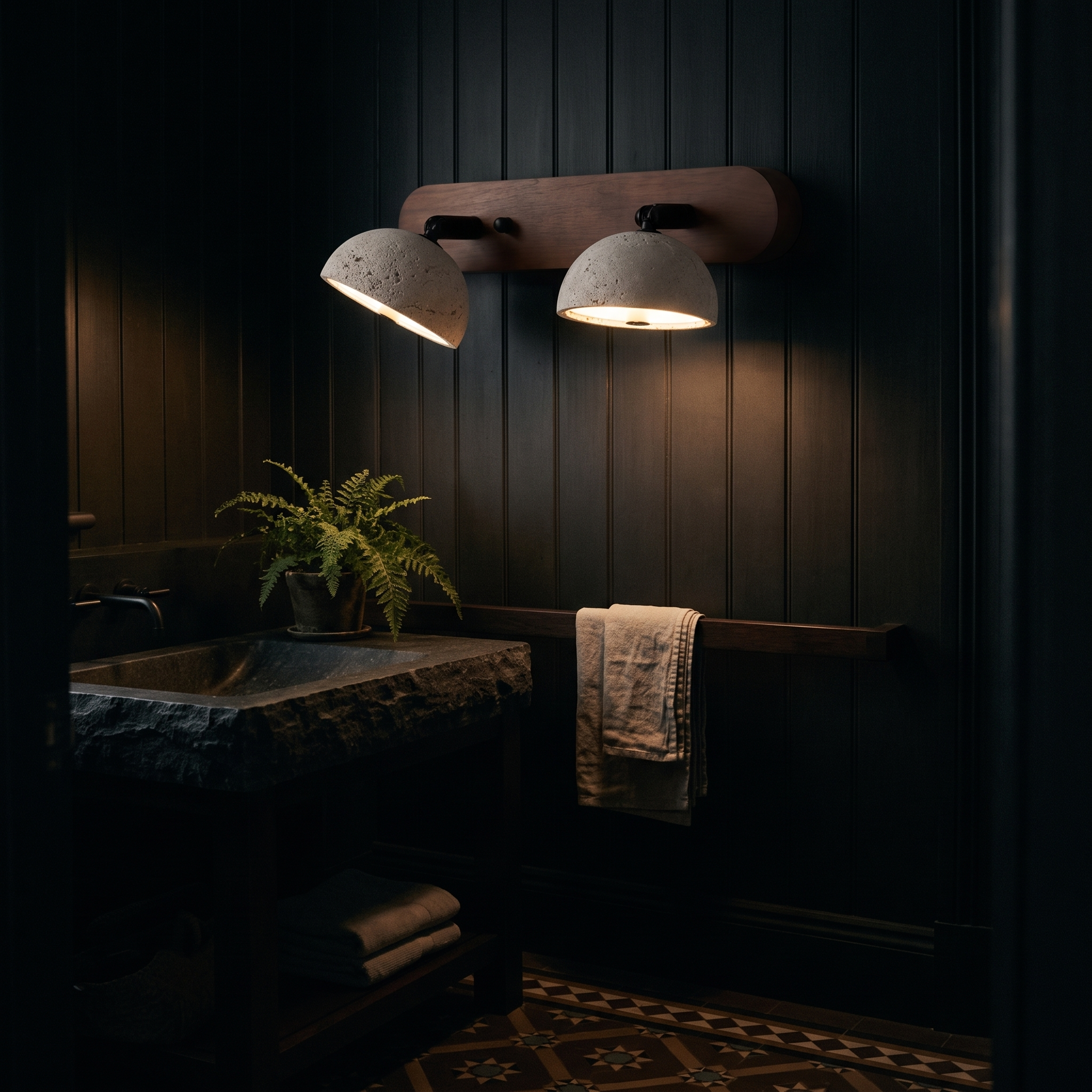 Kassiopeia Adjustable Travertine Dome Vanity Light lit at night in an Auckland villa powder room