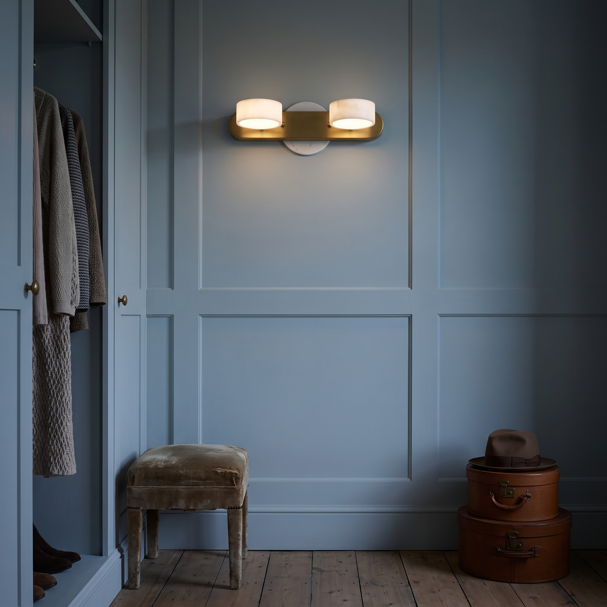 Melpomene Travertine and Marble Vanity Light lit at night in a Norwich Georgian house dressing room