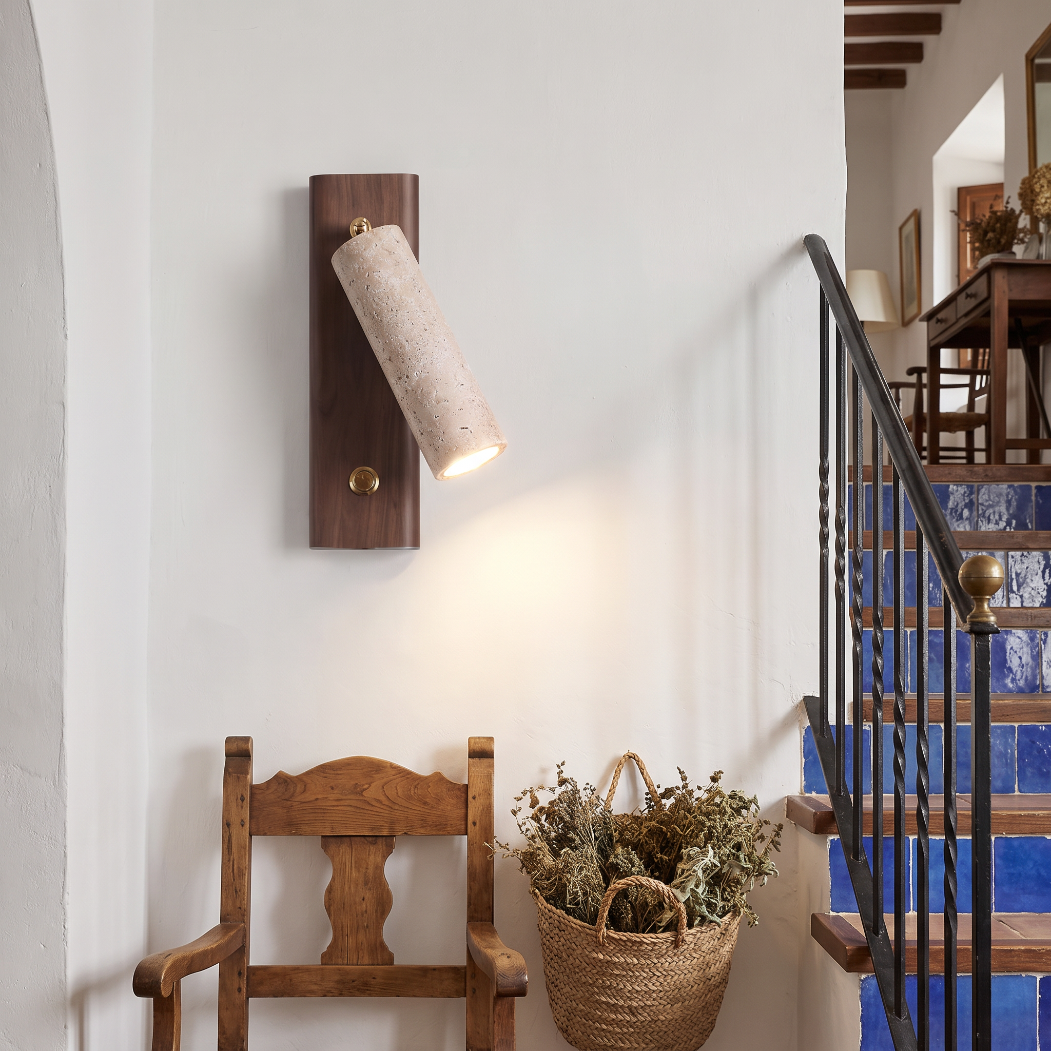 Orpheus Travertine Torch Wall Lamp shown close in a Ronda Andalusian house stairwell