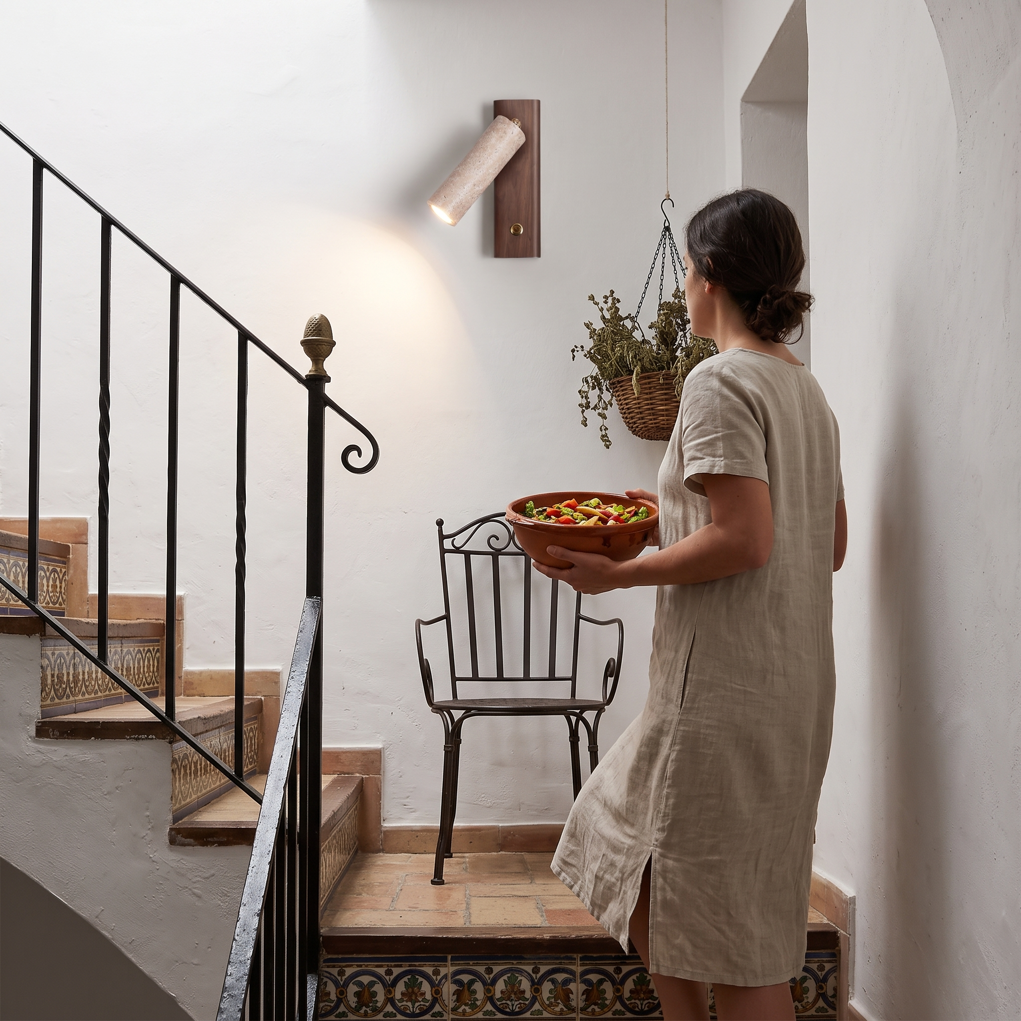 Orpheus Travertine Torch Wall Lamp lit in a Ronda Andalusian house stairwell