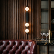 Glaukos - Black Travertine and Opal Globe Sconce