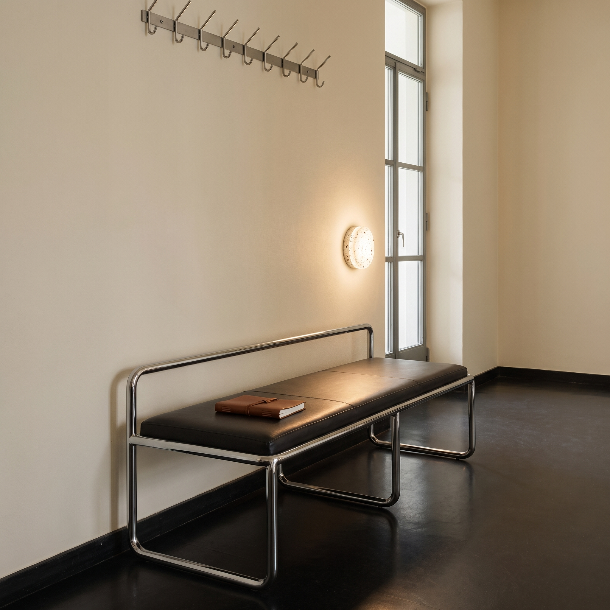 Argyra - Terrazzo Disc Wall Lamp in White Terrazzo shown lit in an interior