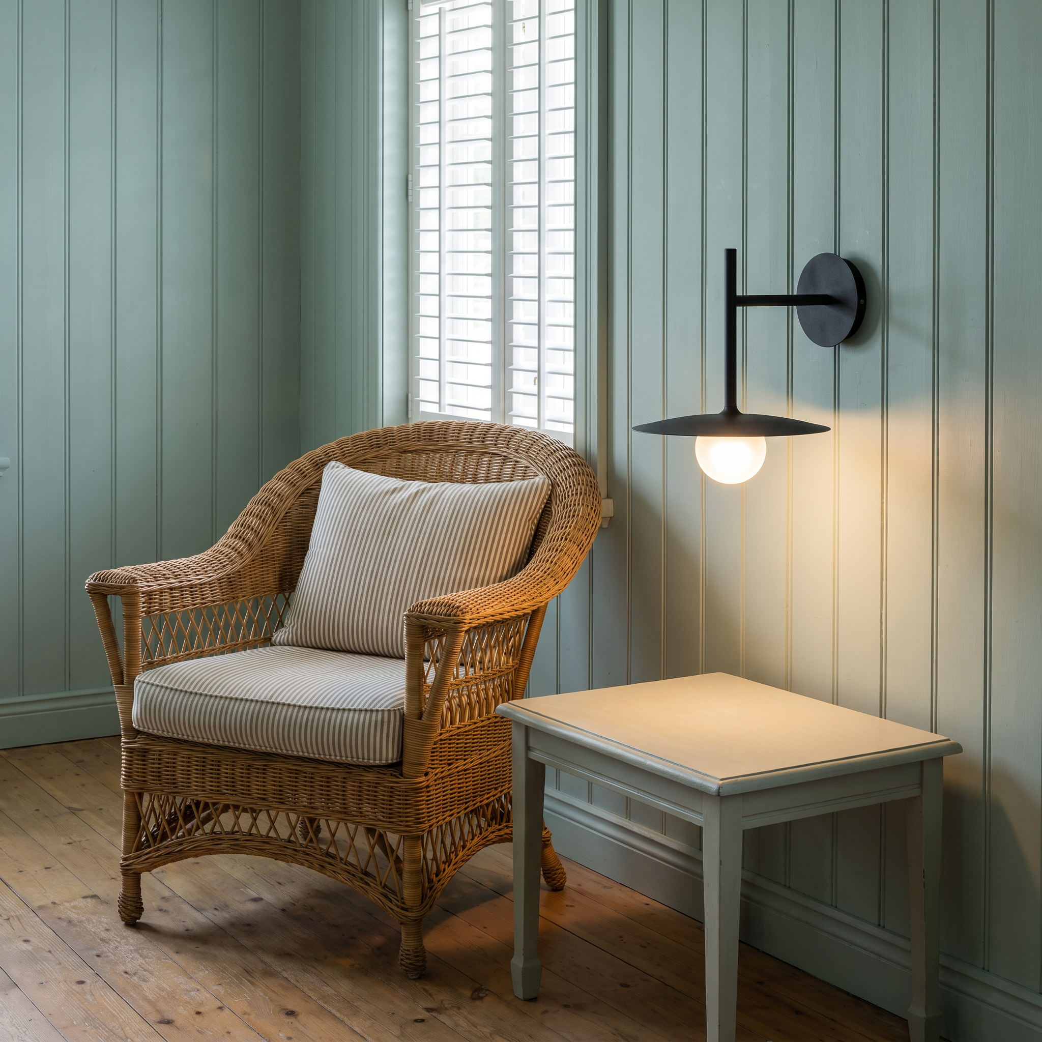 Hesione - Ironwork and Glass Wall Lamp in Black shown lit in an interior