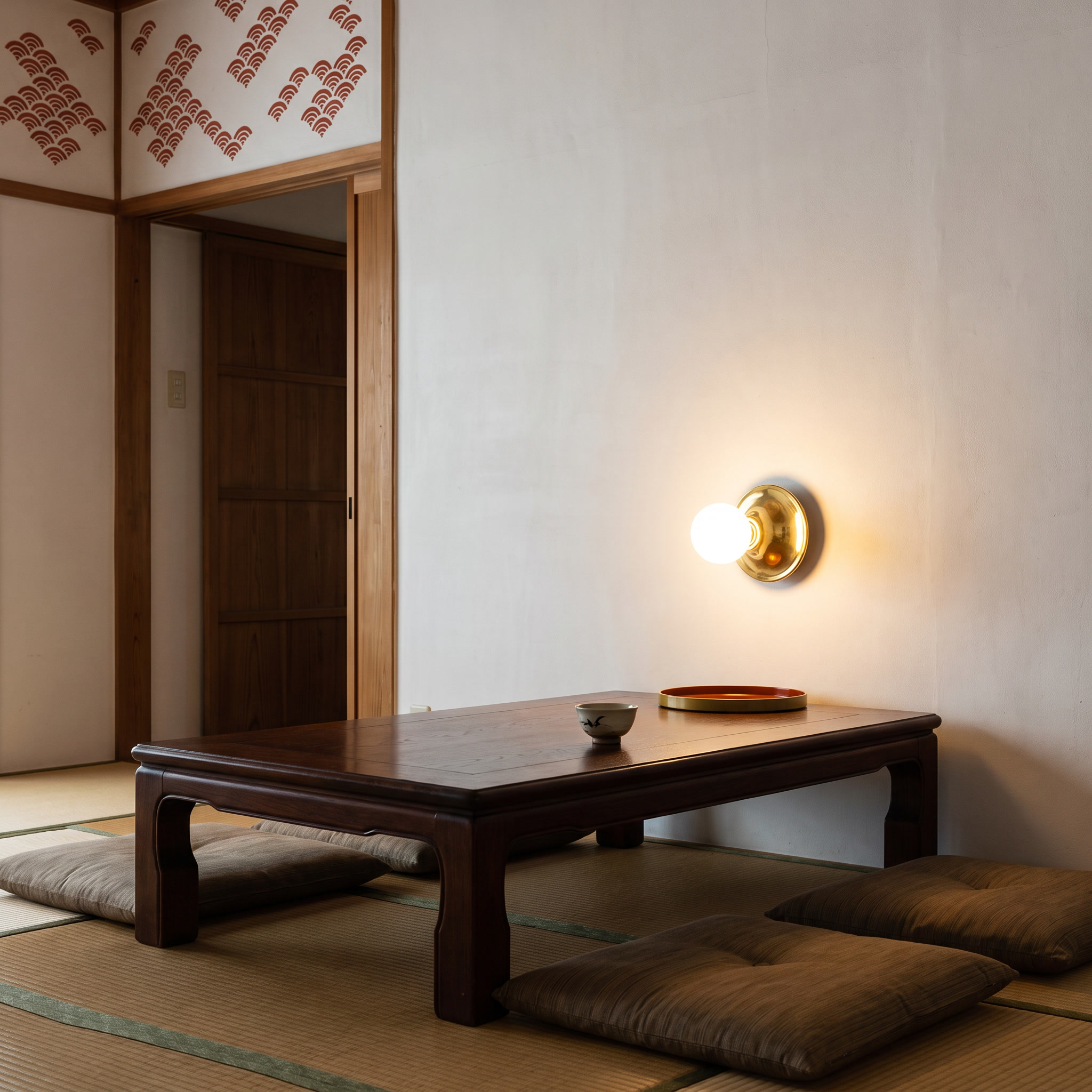 Apseudes - Trumpet Base Wall Sconce in Gold with white glass bulb shown lit in an interior