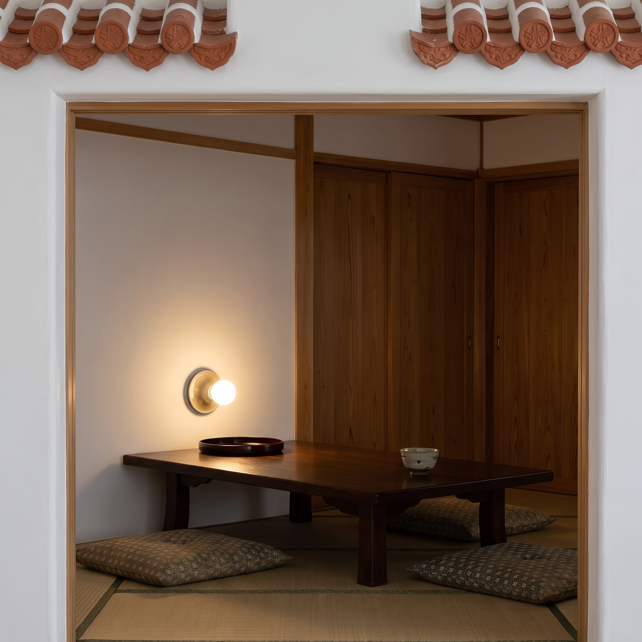 Apseudes - Trumpet Base Wall Sconce shown lit in a Ryukyu house sitting room