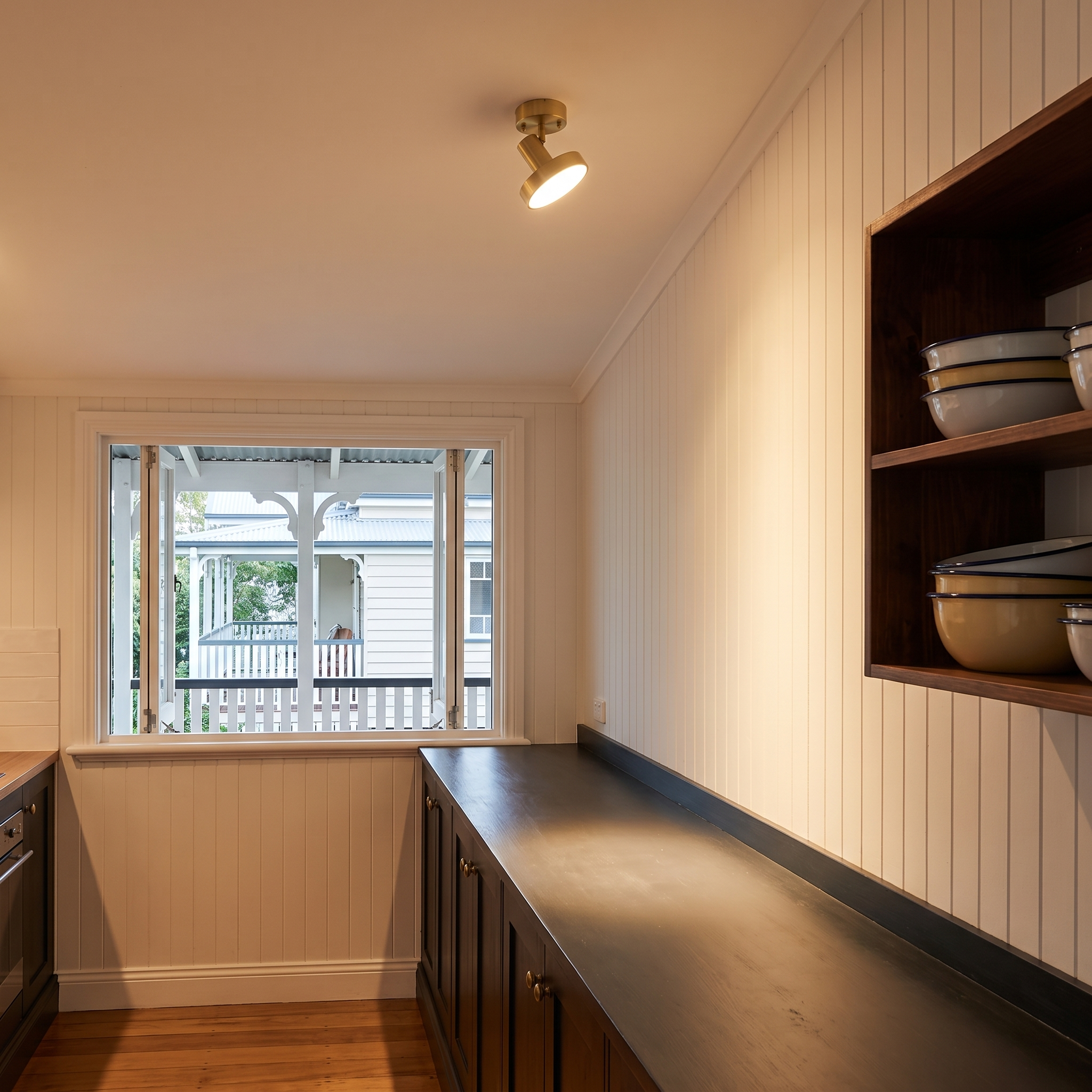 Horme rotating ceiling lamp above a timber kitchen counter