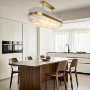 Hermione glass rod chandelier in an airy kitchen with white cabinetry