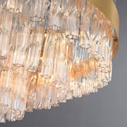 Hermione chandelier close up of the clear glass rods and the metal band that holds them