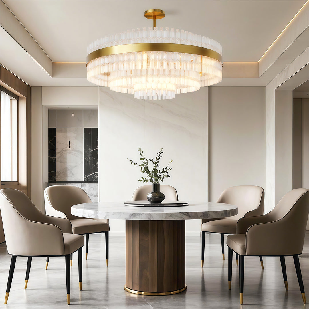 Hermione brass and glass rod chandelier above a round dining table