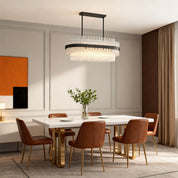 Hermione glass rod chandelier in a warm dining room with contemporary furniture